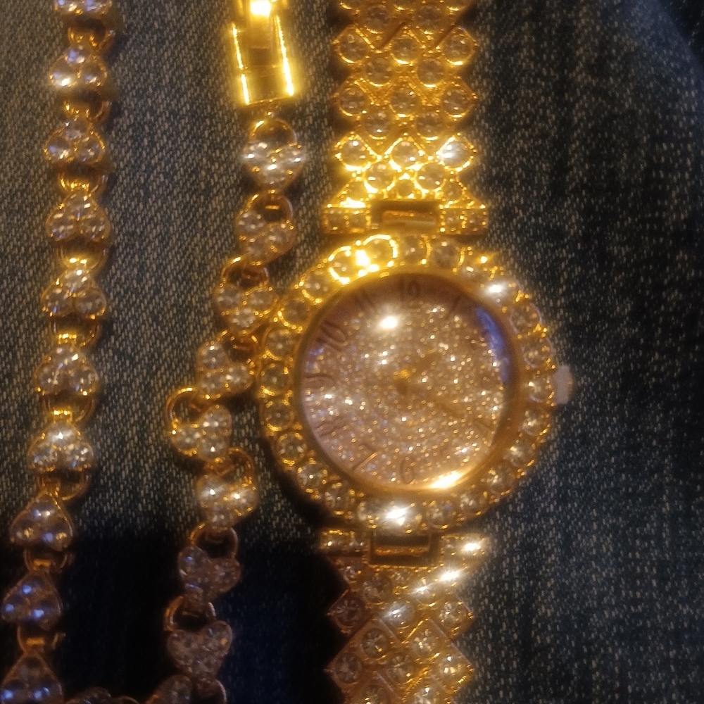 Women gold and diamond watch and bracelet